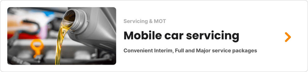 Close-up of a car dashboard showing high mileage, often used by dishonest mechanics to scare customers into repairs.